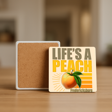Load image into Gallery viewer, Life's A Peach Stone Coaster featuring bold retro design