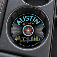 Load image into Gallery viewer, Austin Rocks car coaster, right-side finger notch, in a cupholder
