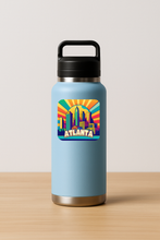Load image into Gallery viewer, Atlanta Vivid Sunrise Sticker with bold colors and retro-future design
